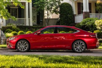 Side profile shot of a red 2019 Lexus ES 300h