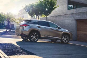 Side profile shot of a silver 2022 Lexus RX450h Hybrid