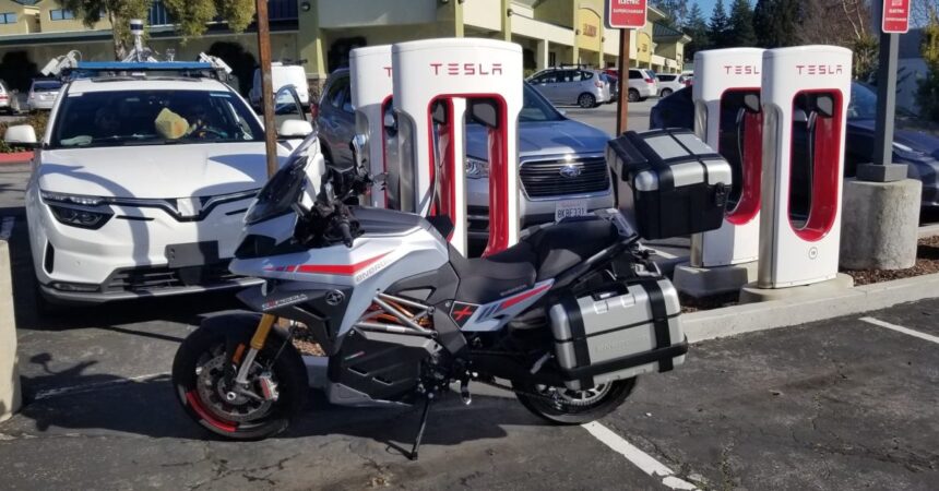 Long range electric motorcycles are now charging up at Tesla Superchargers