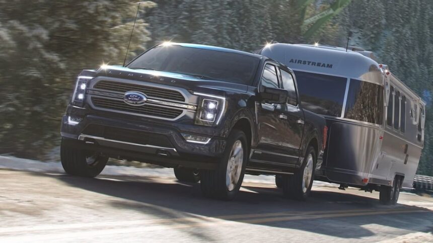 Image of F-150 Hybrid towing courtesy of Ford