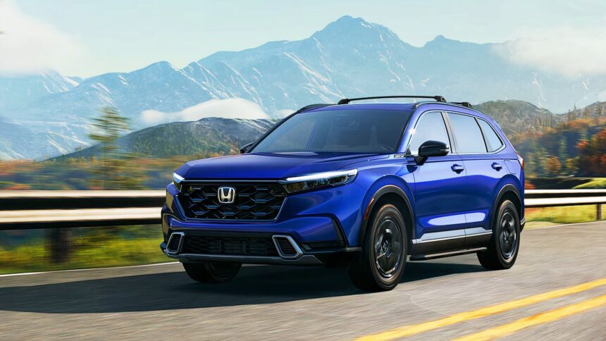 A blue Honda CR-V Hybrid small hybrid SUV is driving on the road.