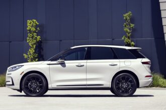 Static side profile shot of a white 2025 Lincoln Corsair.