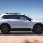 Side profile shot of a white 2025 Honda CR-V Hybrid Sport