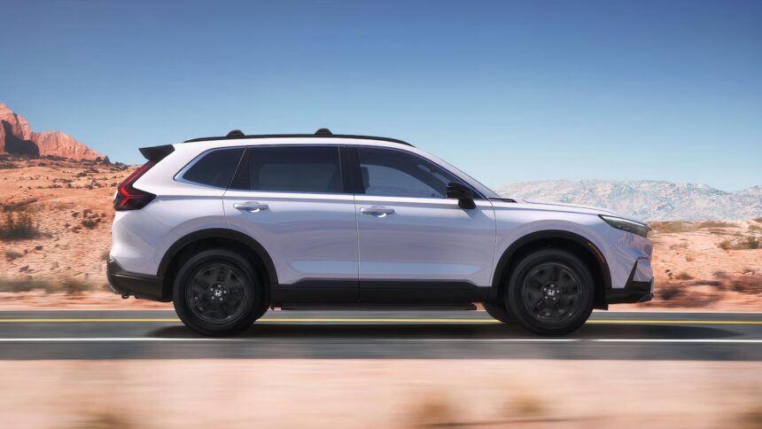 Side profile shot of a white 2025 Honda CR-V Hybrid Sport