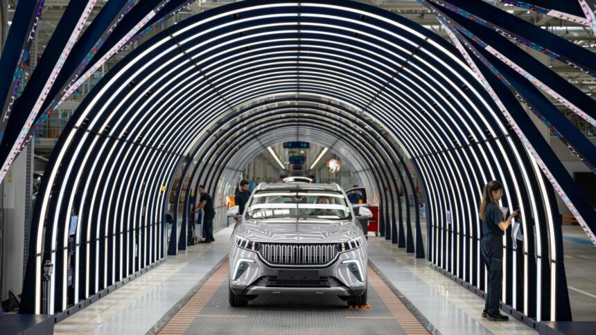Employees work on a car assembly line at a Togg factory at the Gemlik Togg Technology Campus, Bursa, northwestern Türkiye, May 17, 2024. (AFP Photo)